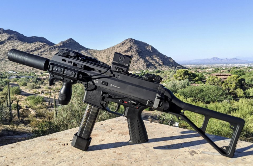 B&T APC9 Pro with suppressor and red dot — mountain vista