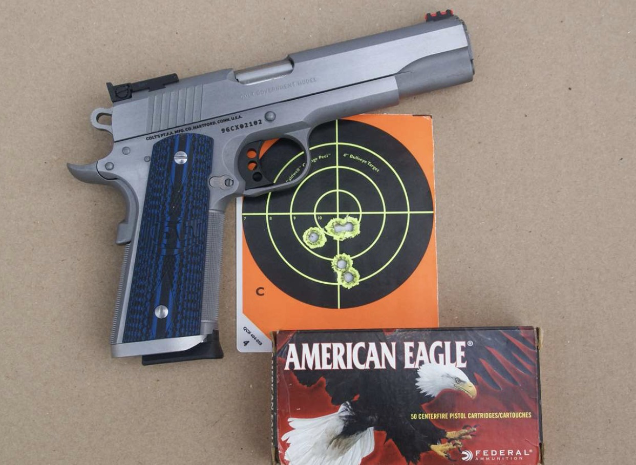 Colt Gold Cup Trophy with shot target and American Eagle .45 ACP